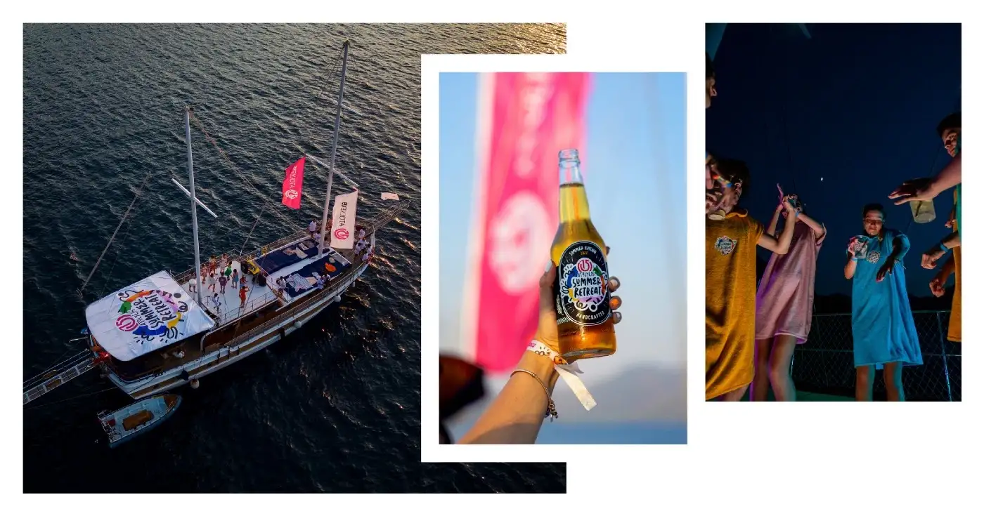 A boat in the sea and a beer bottle with the Atolye15 Summer Retreat logo on them, and people dancing in towel ponchos at night.